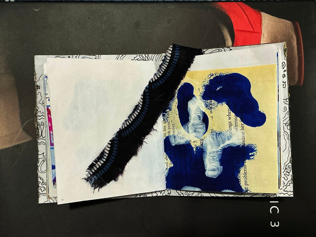 Artistic collage with blue abstract shapes and text on a dark background